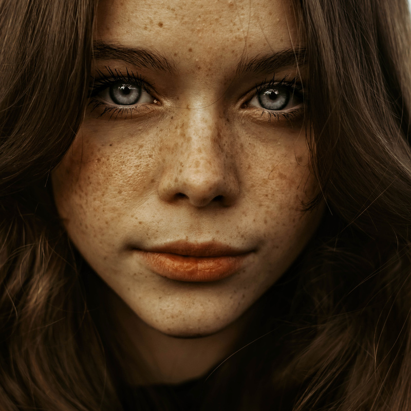 Woman With Brown Hair and Black Eyes